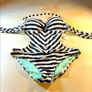 Xhilaration Black and White One Piece Swimwear with our glass tummy gold accent